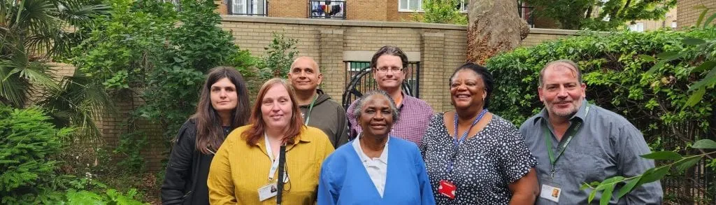 The Choice in Hackney team standing together in the garden at the Marie Lloyd Centre